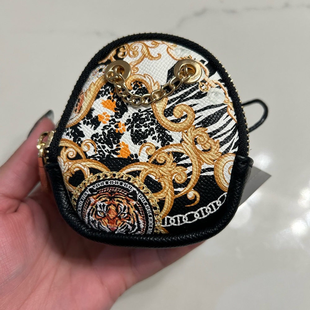 Also mini purse for wrist or boot even arm